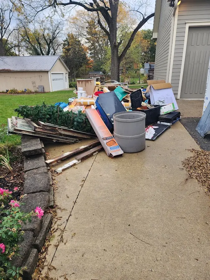 Dumpster being loaded with debris for 30 Yard Dumpster Rental in Hicksville